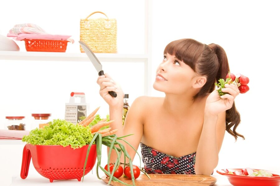 the girl prepares vegetables on a 6-petal diet